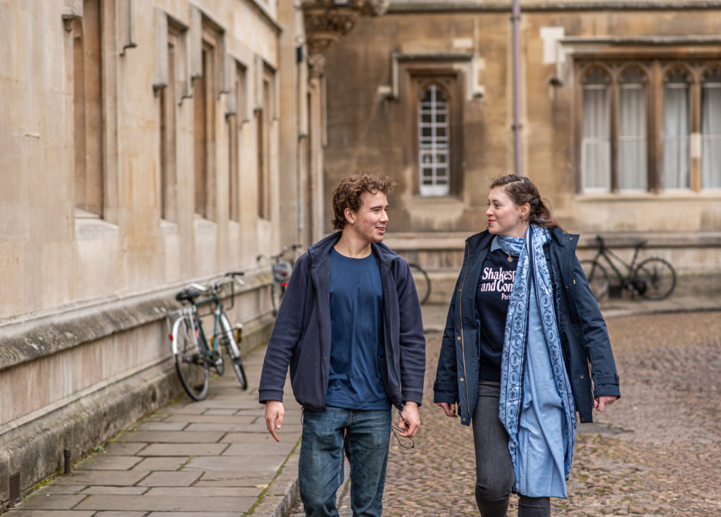 Two A level students walking side-by-side through Oxford